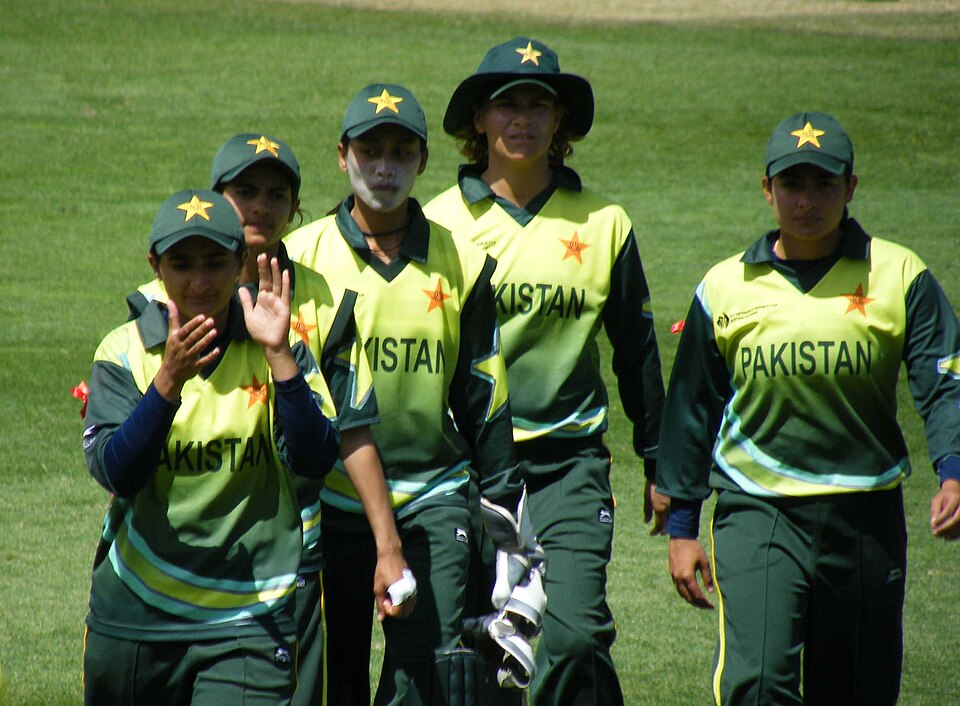 Pakistan Women's cricket team walking off the field in green jerseys during a match